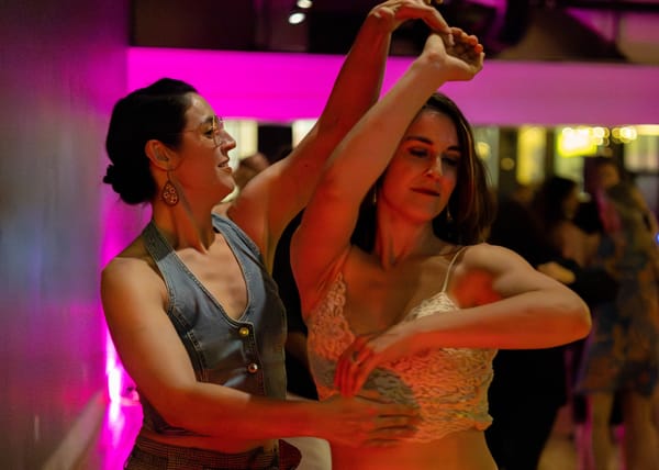 Two sisters dancing